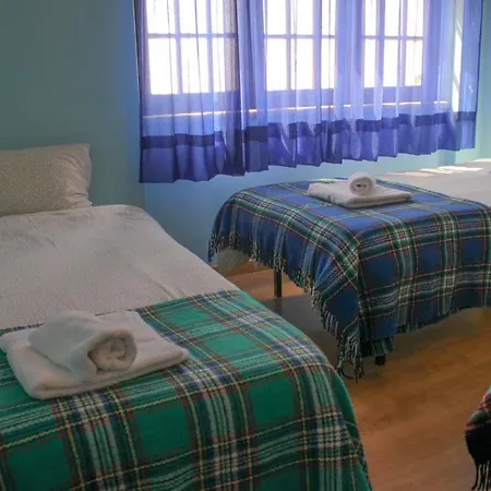 Quarto em Acomodações Particulares Offshore Rustic House *